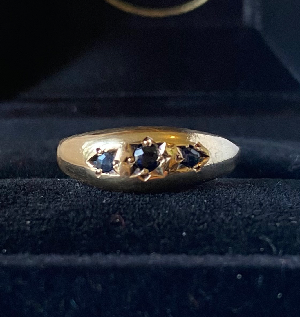 Gold and sapphire gypsy band ring