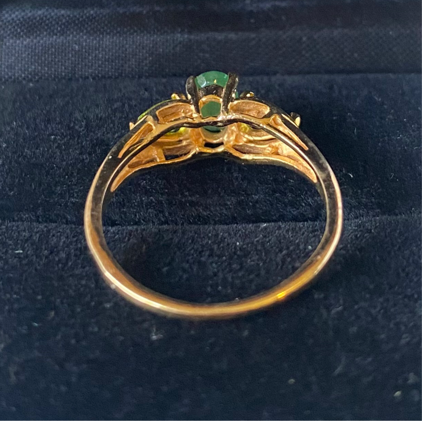 Yellow gold emerald and peridot ring